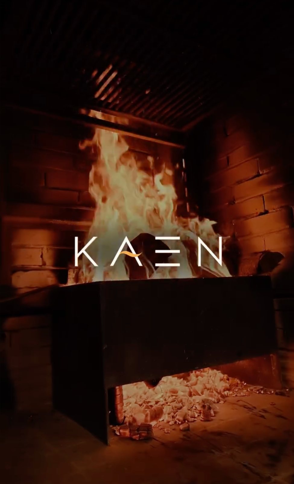 KAEN wordmark over the open fire
