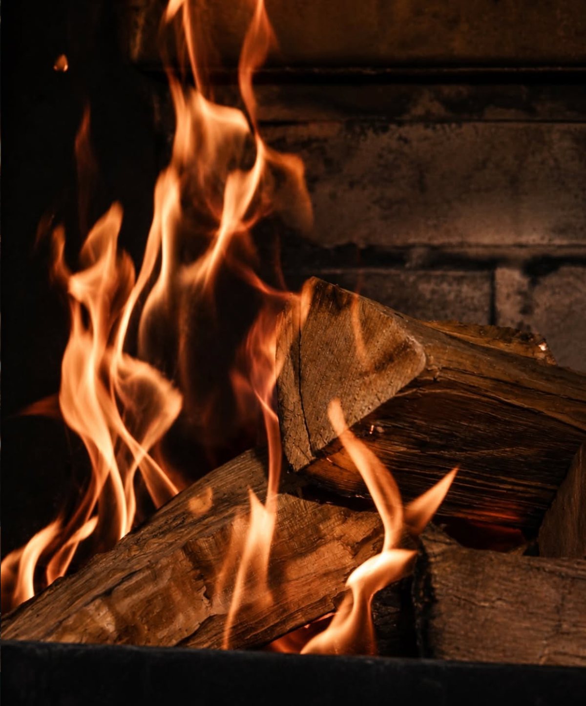 Wood burning over an open flame